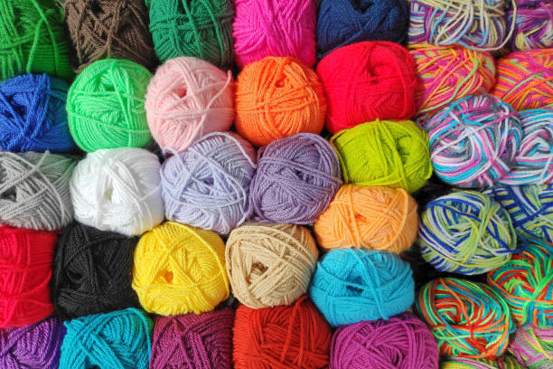 Cover Image featuring various colors of yarn balls